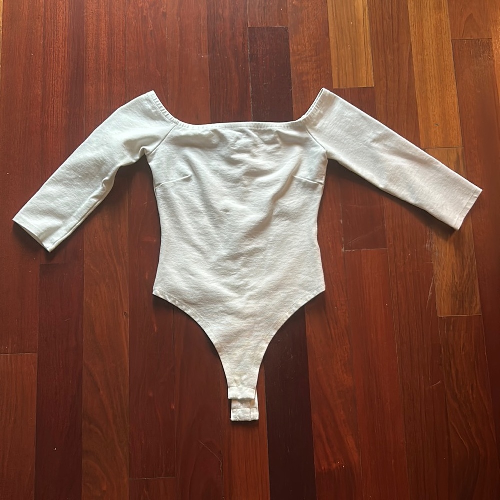 Size XS white off the shoulder body suit.